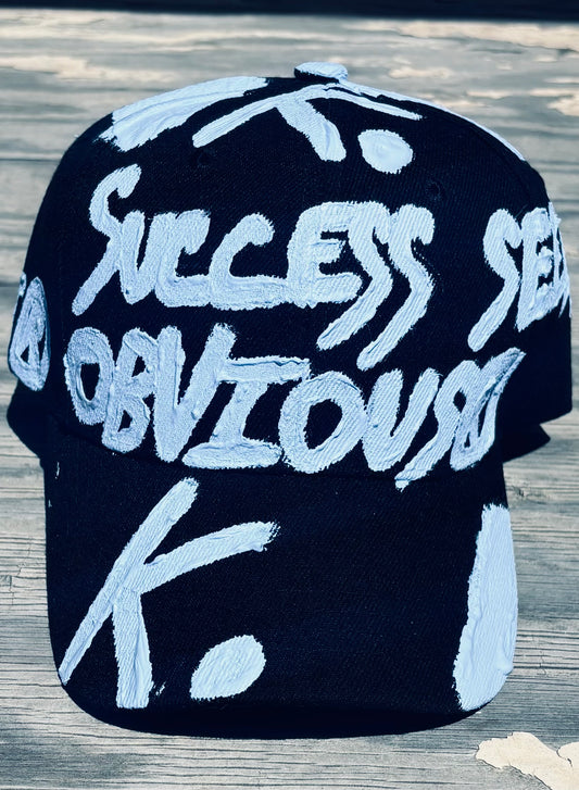 SUCCESS SEEMS OBVIOUS K. HAT