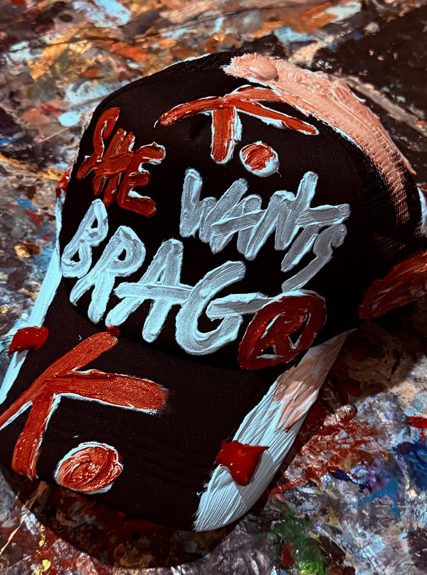 SHE WANTS BRAG K. HAT