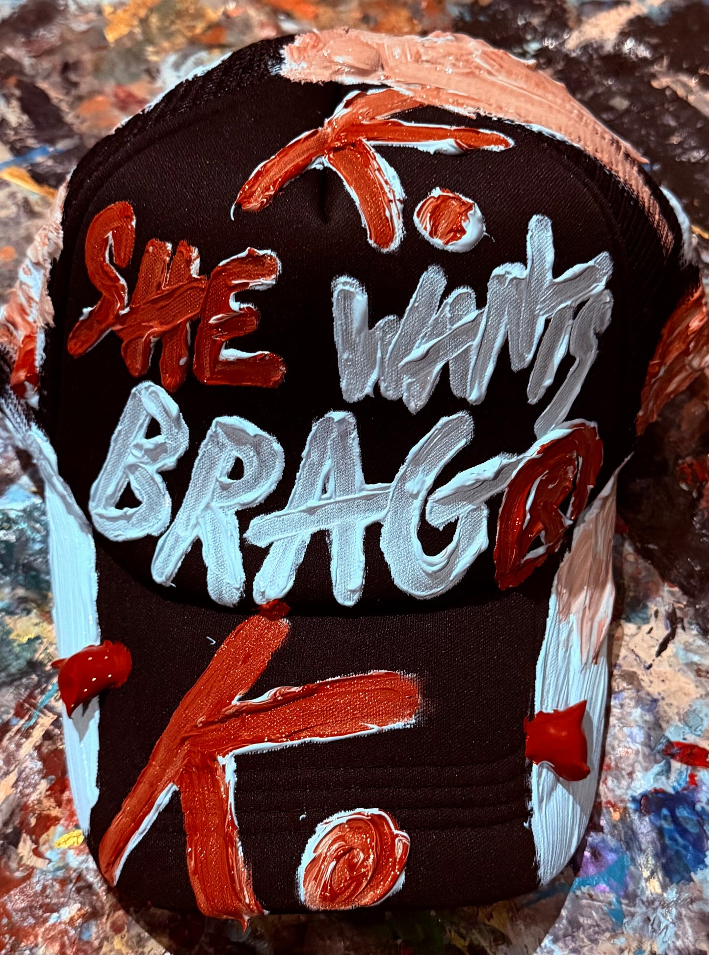 SHE WANTS BRAG K. HAT